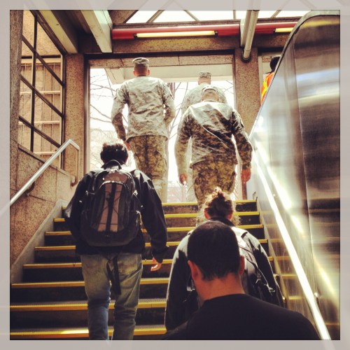 On Thursday, I met a friend for lunch near MIT. This is me walking out of the T station at Kendall/MIT, hours before a shootout would occur nearby. Cambridge, MA.